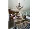 Open concept floor plan with kitchen, dining and living areas with wood-look tile flooring at 12032 Grand Kempston Dr, Gibsonton, FL 33534