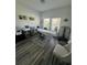 Room features a massage bed, vinyl flooring, and a bright window at 12032 Grand Kempston Dr, Gibsonton, FL 33534