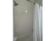 Shower stall features a white shower curtain and white tiled walls at 12032 Grand Kempston Dr, Gibsonton, FL 33534