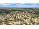Scenic aerial view of a residential neighborhood featuring tree-lined streets, well-maintained homes, and a sense of community at 12401 Yorktown Ln, Bayonet Point, FL 34667