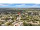 Picturesque neighborhood with tree-lined streets, well-maintained homes, and a tranquil pond creates an inviting residential community at 12401 Yorktown Ln, Bayonet Point, FL 34667