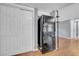 Kitchen area showcasing a black refrigerator and storage options at 12401 Yorktown Ln, Bayonet Point, FL 34667