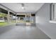Enclosed lanai with neutral walls and ceiling fan, perfect for outdoor relaxation at 12401 Yorktown Ln, Bayonet Point, FL 34667