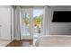 Bedroom with view through french doors out to the backyard and patio at 1302 E Flora St, Tampa, FL 33604