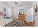 Bright bedroom featuring hardwood floors, a ceiling fan, and a window, creating a relaxing atmosphere at 1302 E Flora St, Tampa, FL 33604