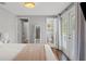 Bedroom with a view into the attached bathroom and a glass door leading to the outside at 1302 E Flora St, Tampa, FL 33604