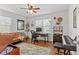 Well-lit home office featuring a desk, comfortable seating, and stylish decor for a productive workspace at 1302 E Flora St, Tampa, FL 33604