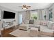 Cozy living room with comfortable seating, hardwood floors, and great natural light creating a warm atmosphere at 1302 E Flora St, Tampa, FL 33604