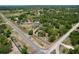 Expansive aerial shot showcasing the home's setting amidst lush greenery in a serene neighborhood at 13341 Hexam Rd, Weeki Wachee, FL 34613