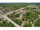Expansive aerial view of a property showcasing its generous acreage, mature trees and proximity to surrounding areas at 13341 Hexam Rd, Weeki Wachee, FL 34613