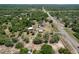 Expansive aerial view of property, showcasing lush greenery and a large home with outbuildings at 13341 Hexam Rd, Weeki Wachee, FL 34613