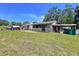 Large backyard has multiple sheds and work spaces at 13341 Hexam Rd, Weeki Wachee, FL 34613