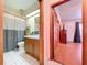 Bathroom with a shower and vanity, connecting to a bedroom at 13341 Hexam Rd, Weeki Wachee, FL 34613