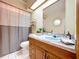 Bright bathroom featuring a modern vanity, a unique blue sink, and stylish fixtures at 13341 Hexam Rd, Weeki Wachee, FL 34613