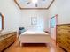 Light-filled bedroom with hardwood floors and a serene atmosphere at 13341 Hexam Rd, Weeki Wachee, FL 34613
