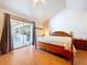 Bright bedroom with sliding glass doors to an outdoor seating area at 13341 Hexam Rd, Weeki Wachee, FL 34613