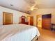 Large bedroom with vaulted ceilings, TV, and wood furniture at 13341 Hexam Rd, Weeki Wachee, FL 34613