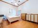 Bedroom featuring wood floors, vaulted ceiling, and white walls at 13341 Hexam Rd, Weeki Wachee, FL 34613