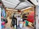 Open garage with an assortment of tools, storage, and equipment creating a functional workspace at 13341 Hexam Rd, Weeki Wachee, FL 34613