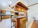 Spacious kitchen with wood cabinets, large island, and white tiled floor at 13341 Hexam Rd, Weeki Wachee, FL 34613