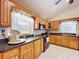 Bright kitchen featuring wood cabinets, modern appliances, and ample counter space for cooking and meal preparation at 13341 Hexam Rd, Weeki Wachee, FL 34613