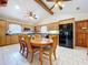 Kitchen and dining area with updated appliances and wood accents at 13341 Hexam Rd, Weeki Wachee, FL 34613