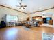 Bright living room features hardwood floors, an open layout, and abundant natural light at 13341 Hexam Rd, Weeki Wachee, FL 34613