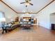 Bright, open living room featuring vaulted ceilings, hardwood floors, and ample space for entertaining at 13341 Hexam Rd, Weeki Wachee, FL 34613