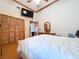 Comfortable main bedroom with hardwood floors, a ceiling fan, and closet with panel doors at 13341 Hexam Rd, Weeki Wachee, FL 34613