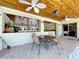Covered patio with outdoor seating area and access to outdoor kitchen at 13341 Hexam Rd, Weeki Wachee, FL 34613