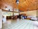 Large, covered patio featuring wood ceiling, dining area, and lounge area at 13341 Hexam Rd, Weeki Wachee, FL 34613