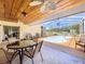 Screened in pool area has a covered dining area at 13341 Hexam Rd, Weeki Wachee, FL 34613