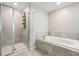 Bright bathroom features a shower and soaking tub with tile surround at 1396 White Fox Run, Lutz, FL 33549