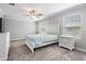 Light-filled bedroom with a ceiling fan and a luxurious bed and nightstands at 1396 White Fox Run, Lutz, FL 33549
