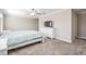 Bright bedroom features a ceiling fan and white dresser with a mounted TV at 1396 White Fox Run, Lutz, FL 33549