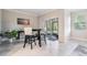 Modern dining area with sliding glass doors and a view of the outdoors at 1396 White Fox Run, Lutz, FL 33549