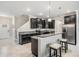Stylish kitchen featuring bar seating, modern cabinets, and stainless appliances at 1396 White Fox Run, Lutz, FL 33549