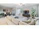 Spacious living room with large windows and a cozy seating area at 1396 White Fox Run, Lutz, FL 33549