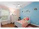 Bright bedroom featuring a cheerful design with vibrant colors and plenty of natural light at 14612 Corkwood Dr, Tampa, FL 33626