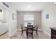 Cozy breakfast nook with a round table, four chairs, and plenty of natural light at 14612 Corkwood Dr, Tampa, FL 33626