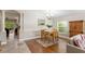 Cozy dining area with hardwood floors, a classic wooden table, and ample natural light at 14612 Corkwood Dr, Tampa, FL 33626