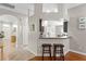 Kitchen area featuring a breakfast bar with stools, tile floors, and an open layout at 14612 Corkwood Dr, Tampa, FL 33626