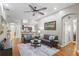 Inviting living room features a ceiling fan, recessed lighting, and an open layout to kitchen and entry at 14612 Corkwood Dr, Tampa, FL 33626