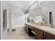 Luxurious main bathroom features a soaking tub, glass enclosed shower and double vanity sinks at 14612 Corkwood Dr, Tampa, FL 33626