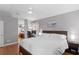 Bright and airy main bedroom with ceiling fan and an attached office space at 14612 Corkwood Dr, Tampa, FL 33626