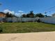 Spacious backyard featuring a well-maintained lawn and a privacy fence, perfect for outdoor activities at 1462 Highfield Dr, Clearwater, FL 33764