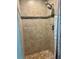 Shower featuring detailed tile and an adjustable showerhead and updated hardware at 1462 Highfield Dr, Clearwater, FL 33764
