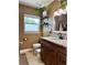 Bathroom featuring granite vanity with dark wood cabinets, and a neutral color scheme at 1462 Highfield Dr, Clearwater, FL 33764
