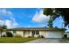 Charming single-story home with well-maintained lawn and a lovely, classic curb appeal in a quiet neighborhood at 1462 Highfield Dr, Clearwater, FL 33764