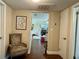 Hallway showcasing an open view into a living area, featuring stylish decor and hardwood floors at 1462 Highfield Dr, Clearwater, FL 33764
